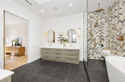 Modern bathroom with stylish decor and herringbone tile.